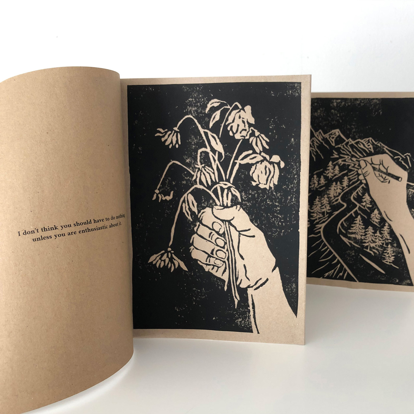 leporello pages with a quote and hand illustrations